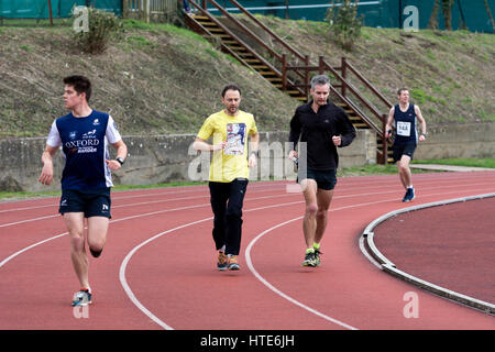 Runners warming up at the Iffley Road track before the annual Teddy Hall Relays, Oxford, UK Stock Photo