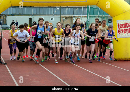 Women runners at Iffley Road track at the start of the Teddy Hall Relays, Oxford, UK Stock Photo