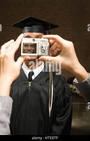 Male graduate having his photograph taken Stock Photo