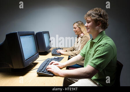 Two students working on computers Stock Photo