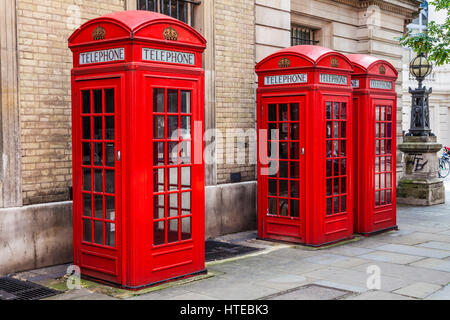 A row of red telephone boxes in London. Stock Photo