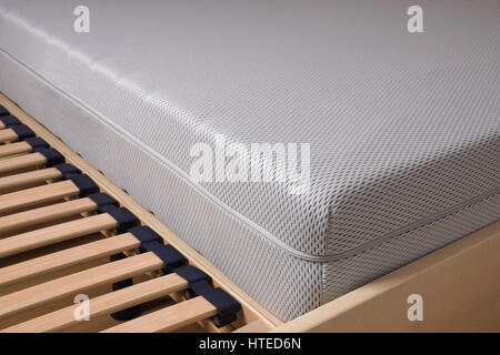 close-up of bed with cold foam mattress on slatted frame Stock Photo