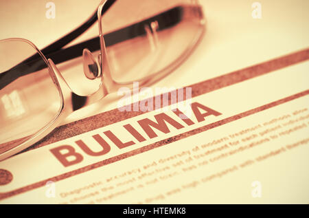 Bulimia - Medical Concept with Blurred Text and Specs on Red Background. Selective Focus. Bulimia - Printed Diagnosis with Blurred Text on Red Backgro Stock Photo