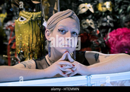 Posed portrait of a transitioning transgender woman with red nail polish photogrpahed in New York City Stock Photo