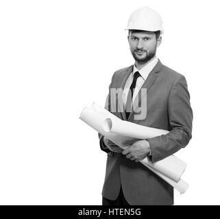 Checking his measurements. Handsome serious mature male businessman architect looking to the camera confidently wearing protective hardhat holding his Stock Photo