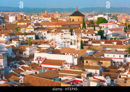 Roof of the old city and church Iglesia del Colegio de Santa Victoria, aerial view from the bell tower at the Mezquita in Cordoba, Andalusia, Spain Stock Photo