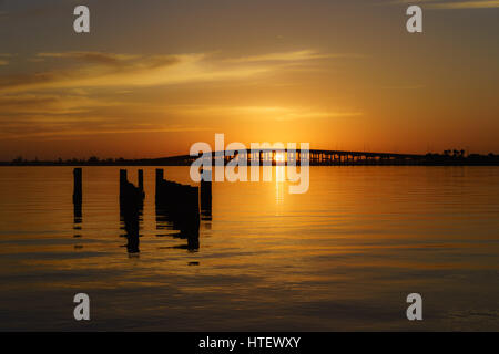 The Sunrise over the Melbourne Causeway Bridge to the Barrier Island and Beaches Stock Photo