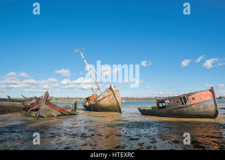 Pin Mill Suffolk, view of abandoned sailing boats left to decay along the banks of the River Orwell near the Suffolk village of Pin Mill, England, UK. Stock Photo