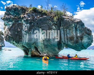 Paddling tourist in kajak at the marmor caves near Rio Tranquilo, a village at the Carretera Austral, Patagonia, Chile Stock Photo