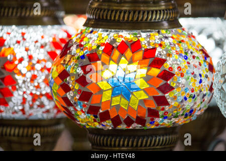 Turkish colorful decorative lamps with glass color mosaics for sale on Bazaar, traditional crafted in Turkey. Close up, blur background Stock Photo