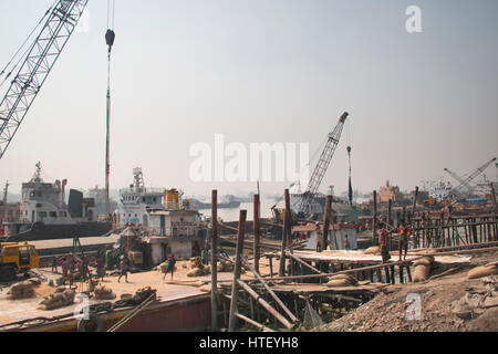 CHITTAGONG, BANGLADESH - FEBRUARY 2017: The port with many people and boats in the center of Chittagong in Bangladesh Stock Photo
