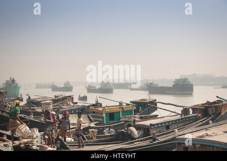 CHITTAGONG, BANGLADESH - FEBRUARY 2017: The port with many people and boats in the center of Chittagong in Bangladesh Stock Photo