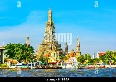 Wat Arun or Wat Chaeng, is situated on the west bank of the Chao Phraya River. Wat Arun or temple of the dawn is partly made up of colourfully decorat Stock Photo