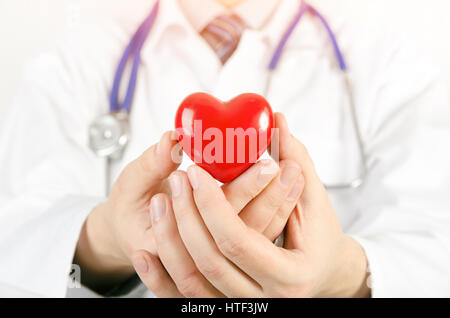 Cardiologist holding heart 3D model. heart medicine doctor healthcare stethoscope medical 3d model concept Stock Photo