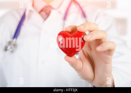 Cardiologist holding heart 3D model. heart medicine doctor healthcare stethoscope medical 3d model concept Stock Photo