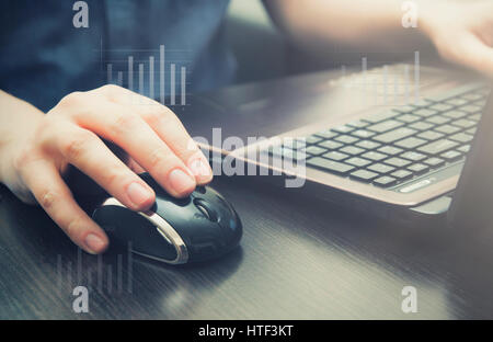 Man using laptop at workplace. mouse computer hand laptop working abstract chart design concept Stock Photo