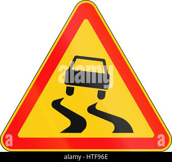 Warning road sign used in Belarus - Slippery road. Stock Photo