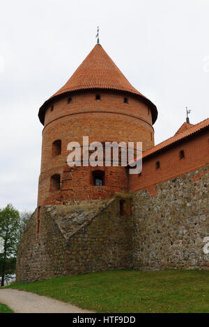 castle tower of red brick is part of the defensive structure Stock Photo