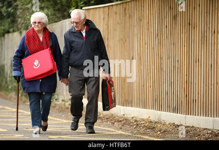 AFC Bournemouth fans making their way to the stadium prior to the Premier League match at the Vitality Stadium, Bournemouth. Stock Photo