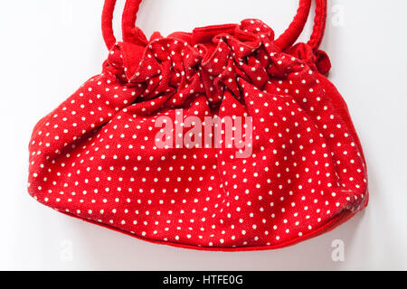 Red and white polka dots bag set on white background Stock Photo