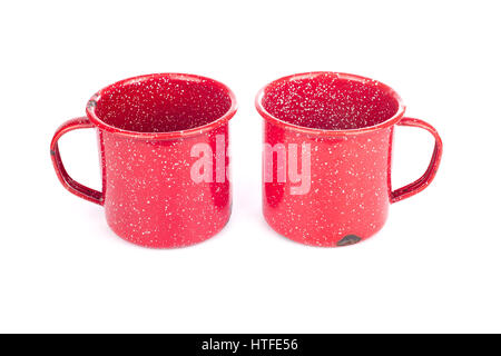 Two vintage red painted metal cups isolated on white Stock Photo