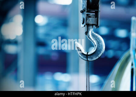 Inside the factory overhead crane hook Closeup Stock Photo