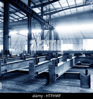 Steel factory floor, stacked with a lot of steel Stock Photo