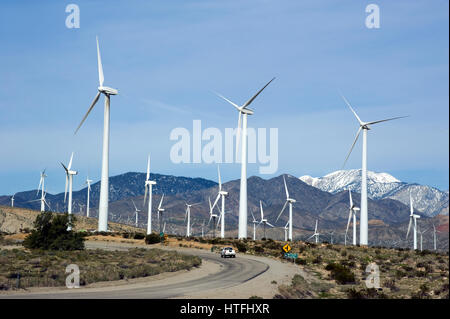 Road through windmill farm in the Palm Desert near Palm Springs, California Stock Photo