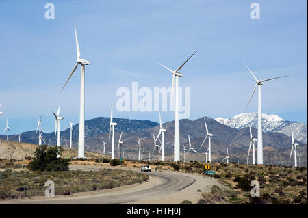 Road through windmill farm in the Palm Desert near Palm Springs Stock Photo