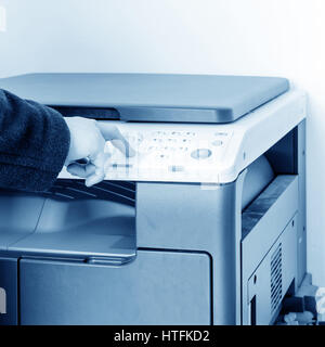 woman using copy machine Stock Photo