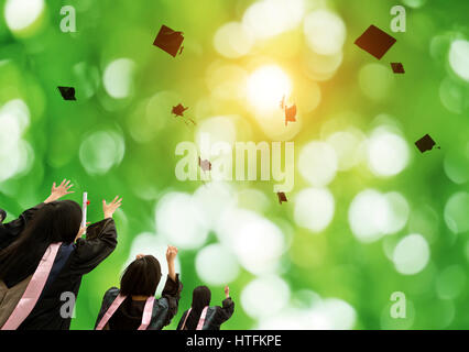 Graduation Caps Thrown in the Air Stock Photo