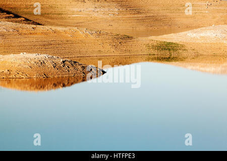 Abstract reflected landscape at San Luis Reservoir in California. Stock Photo