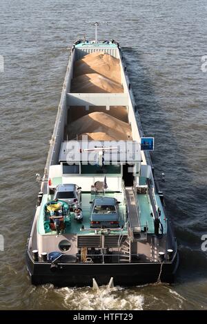 inland general cargo vessel shipping on the river Rhine Stock Photo