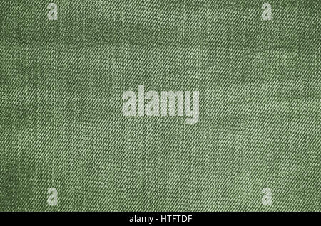 Green texture of jeans textile close up. Blank backdrop for design. Multicolor background set. Stock Photo