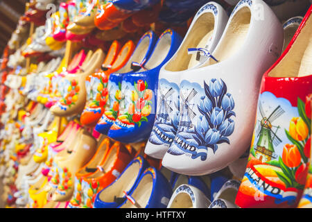 Zaanse Schans, Netherlands - February 25: Colorful Dutch clogs made of poplar wood, traditional shoes with paintings stand on souvenir shop counter Stock Photo