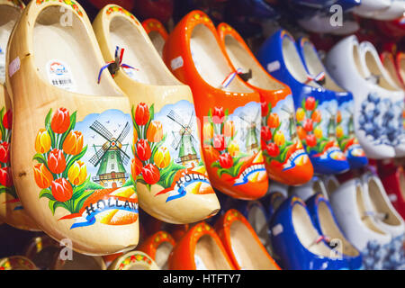 Zaanse Schans, Netherlands - February 25: Dutch clogs made of poplar wood, traditional shoes with colorful paintings stand on souvenir shop counter Stock Photo