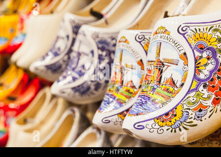Zaanse Schans, Netherlands - February 25: Dutch clogs made of poplar wood, traditional shoes for everyday use with colorful paintings stand on souveni Stock Photo