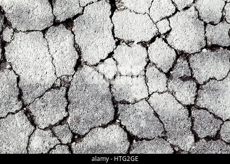 Cracked pavement background. Stock Photo