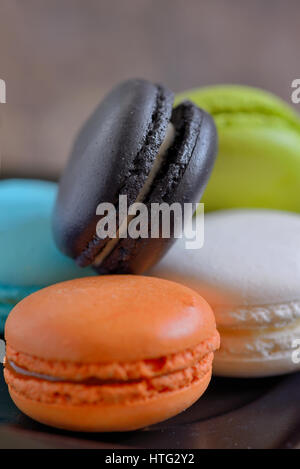 french colorful macarons on wooden table Stock Photo