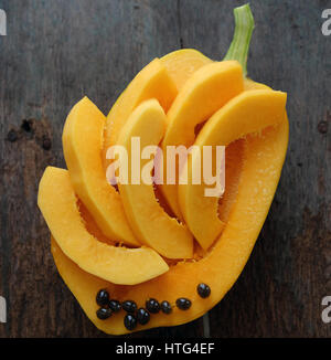 Papaya on wooden background, tropical fruit, rich fiber, vitamin A,C ,E, make healthy heart, prevent atherosclerosis, good for digestive system, tonic Stock Photo