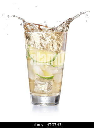 iced lemonade soda in a glass with splashing isolated on white background. Sparkling water with lime and cubes of ice. Cocktail splash from a glass. S Stock Photo