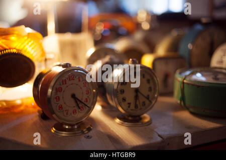 Still life, hours-alarm clocks on the table Stock Photo