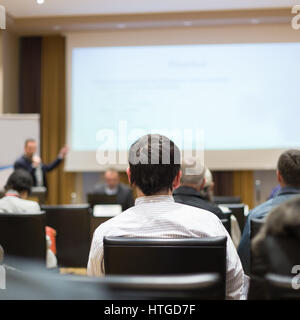 Audience in lecture hall participating at business conference. Stock Photo