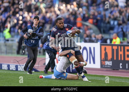 Rome, Italy. 11th Mar, 2017. France's wing Virimi Vakatawa tries to resist to Edoardo Padovani's tackle in the rugby match against Italy in RBS 6Nations  Credit: Massimiliano Carnabuci/Alamy Live News Stock Photo