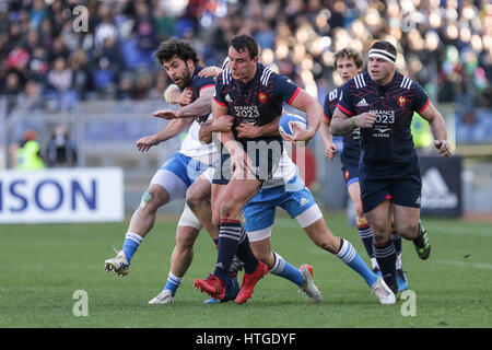 Rome, Italy. 11th Mar, 2017. France's n.8 Louis Picamoles resists to Italian's tackle in the rugby match against Italy in RBS 6Nations  Credit: Massimiliano Carnabuci/Alamy Live News Stock Photo