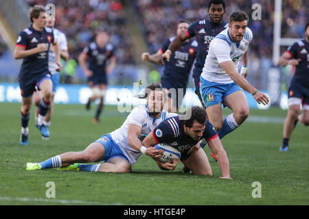 Rome, Italy. 11th Mar, 2017. Italy's centre Michele Campagnaro tackles Remi Lamerat very close to the try line in the rugby match against Italy in RBS 6Nations  Credit: Massimiliano Carnabuci/Alamy Live News Stock Photo