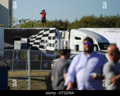 St. Petersburg, Florida, USA. 11th Mar, 2017. CHRIS URSO | Times.A spotter stands atop a tractor trailer in the paddock area during the morning practices at the Firestone Grand Prix of St. Petersburg Saturday, March 11, 2017 in St. Petersburg. Credit: Chris Urso/Tampa Bay Times/ZUMA Wire/Alamy Live News Stock Photo