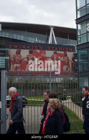 London, England, UK.  11th March 2017. Football fans arriving at Finsbury Park to see Arsenal vs Lincoln City. Lincoln City fans walking past the Emirates Stadium. Andrew Steven Graham/Alamy Live News Stock Photo