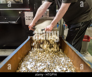 Llantrisant, South Wales, UK. 14th March, 2017. The Royal Mint. From the Tote box the coins are released into the Spillage. The Spillage holds £85,000 of £1 coins. After the coins are taken away, they are counted, packaged, and shipped to a cash distribution centre. © Guy Corbishley/Alamy Live News Stock Photo