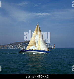 AJAXNETPHOTO. 1989. SOLENT, ENGLAND. - FASTNET RACE YACHT - THE U.S. MAXI YACHT NIRVANA PASSING THE NEEDLES LIGHTHOUSE ON THE FIRST LEG OF THE RACE TO FASTNET ROCK.  PHOTO:JONATHAN EASTLAND/AJAX  REF:890556 1 Stock Photo